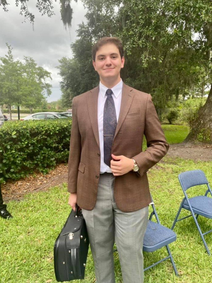 Violinist Christopher Chiarotti shows off the new suit he received at ‘Bespoke on the Boulevard.’ Chiarotti recently graduated from the Douglas Anderson School for the Arts and will be dressed for success as he goes on to college.
